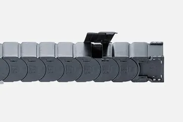 Energy chains for protection against dirt and swarf