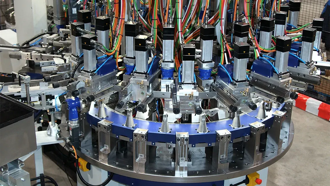 Rotary transfer machine with press