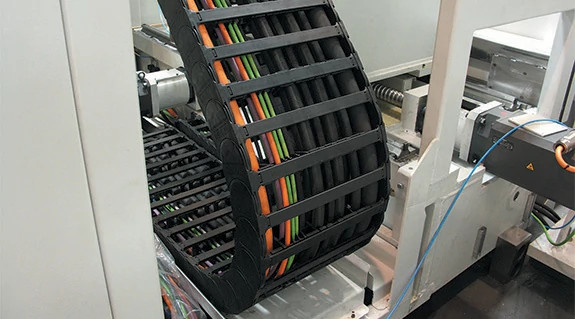 Pre-assembled energy chain in machining centre of DST GmbH | igus ...