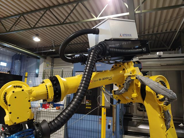 Loading A Machine Loading of machine tools by robots