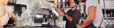 robot arm serving coffee to barista with customer with cup of coffee