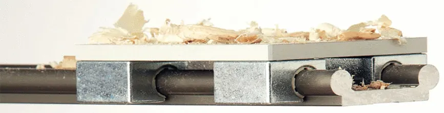 linear guide with wood shavings