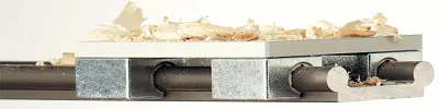 linear guide with wood shavings