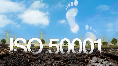 ISO 50001 lettering in front of igus factory with footprint
