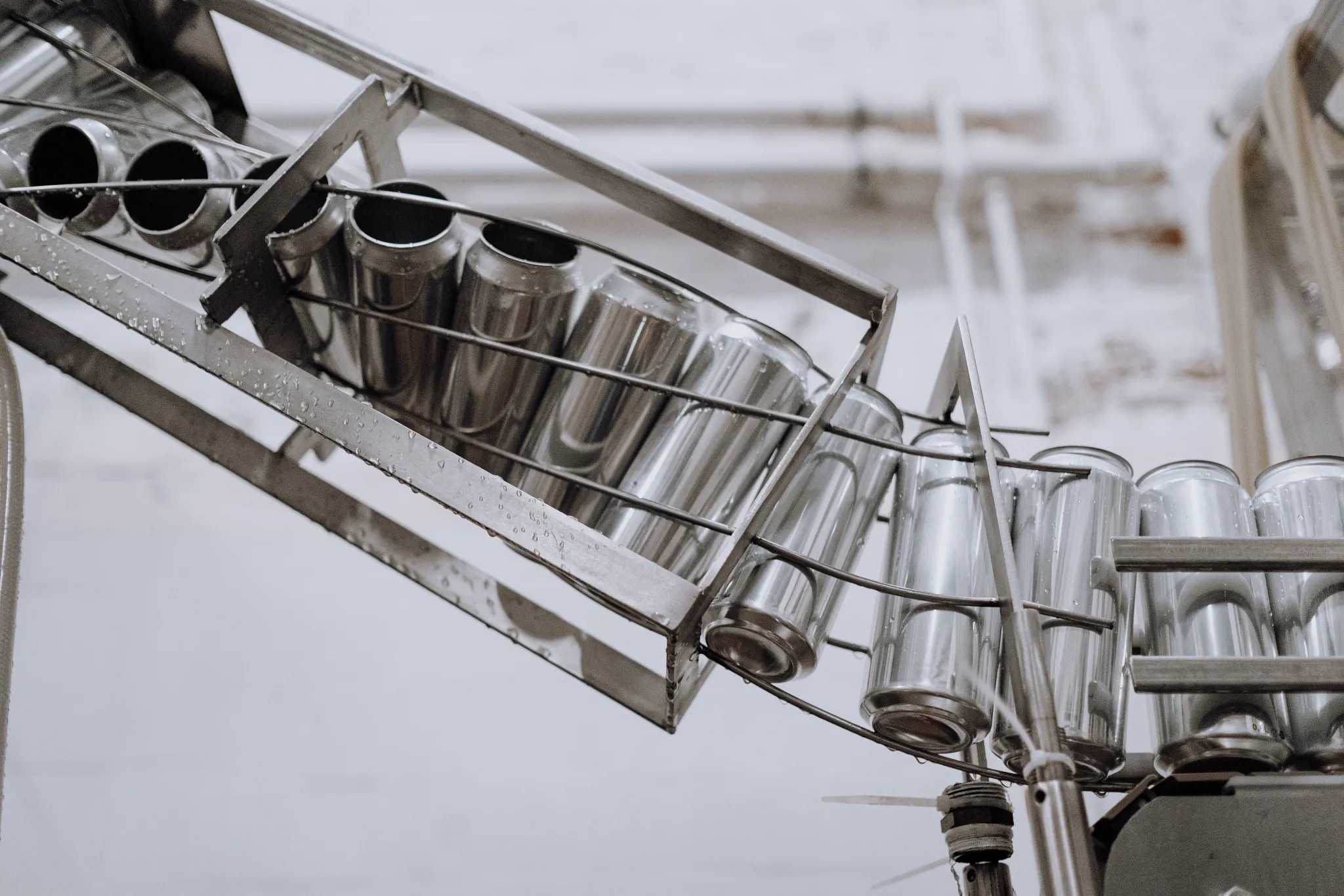 traditional metal product turner on beverage conveyor line 