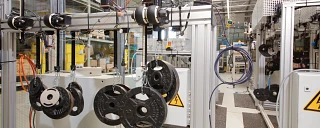 Weights suspended from gearboxes