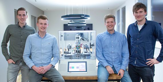 The team for the production of the Rubik's cube solving machine