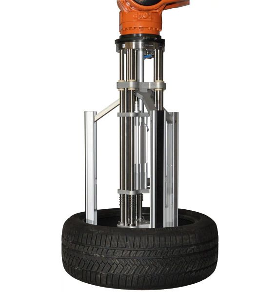 Long arm gripper lifts tyres