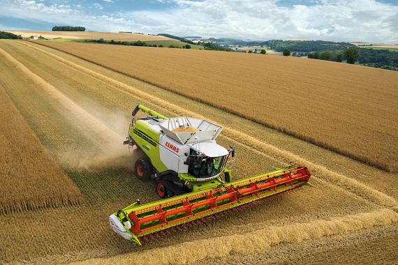 CLAAS combine harvesters in action in the field