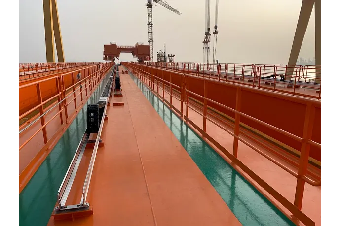 Compact Energy Chain Energy chains supply 16 trolleys on 15,000t shipyard crane