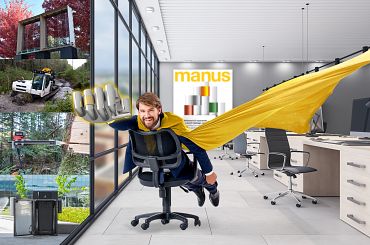 Man on an office chair with superheroe cape