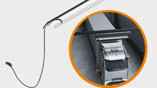 e-tract DC cable management system horizontally in a depot above a lorry that is being loaded