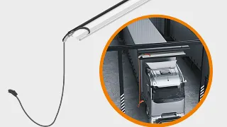 Kabelmanagementsystem e-tract DC horizontal in einem Depot über einem LKW, der geladen wird