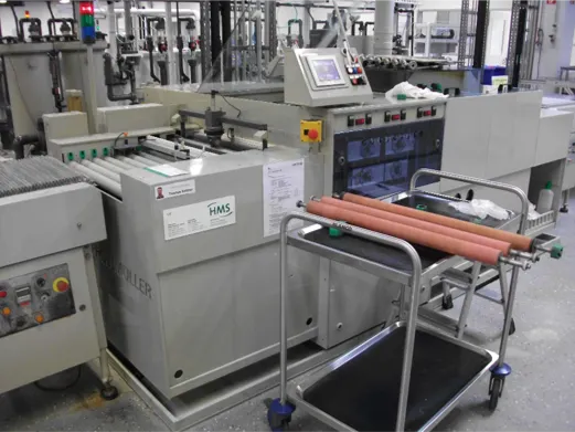 Roller bearing in a circuit board deburring machine