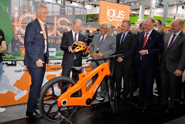 German Chancellor Scholz at the igus trade show booth