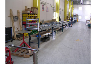 Cable carrier pre-harnessed with cables and connectors