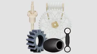 Verschiedene im 3D-Druck entstandene Bauteile, wie etwa Zahnräder oder Doppelgelenklager