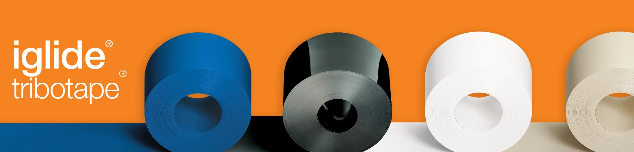 banner photo featuring four rolls of tribotape on an orange background