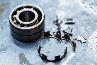 Defective metal ball bearing