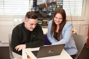 women programming a robot