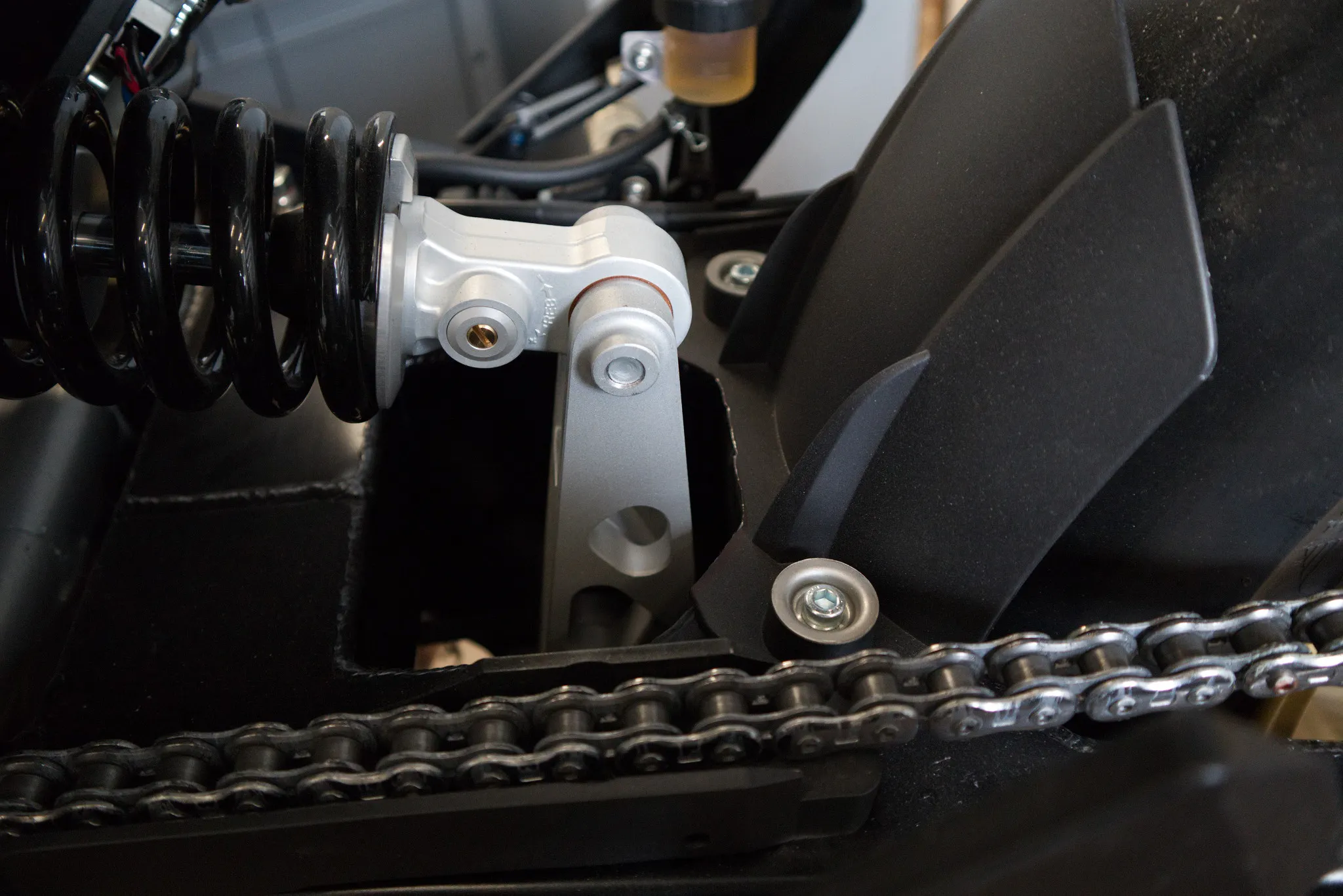 The link helps to absorb shocks on the rear wheel.